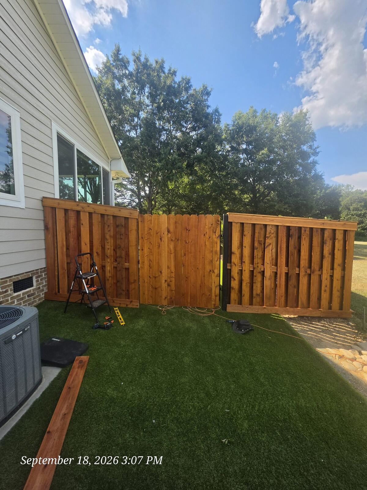 Western red cedar shadowbox fence under construction Monroe NC