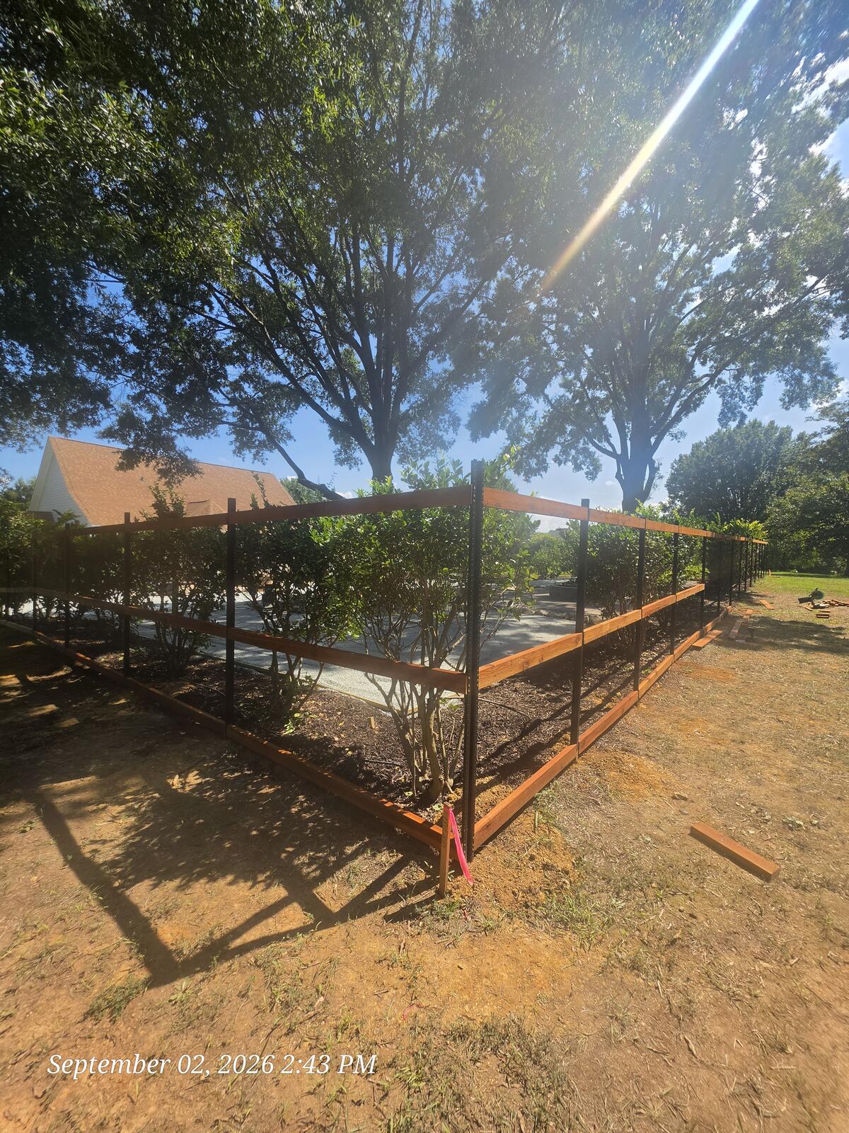 Custom fence framing with steel posts and cedar rails Monroe NC